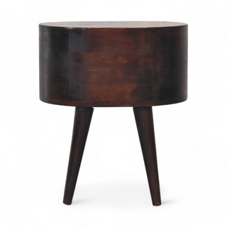 Back view of the round walnut nightstand highlighting its solid wood construction and simple design.