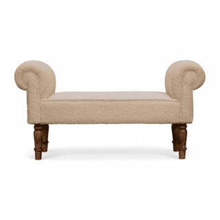 Front view of the upholstered beige bench with rolled arms and carved wooden legs.