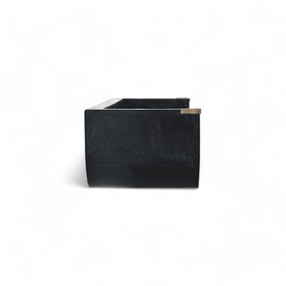 Side view of a black wooden floating shelf with a clean, minimalist structure and brass accents at the corners.