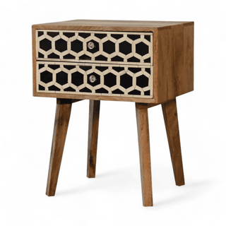 Angled front view of mid-century mango wood nightstand showcasing honeycomb bone inlay drawers and natural wood finish