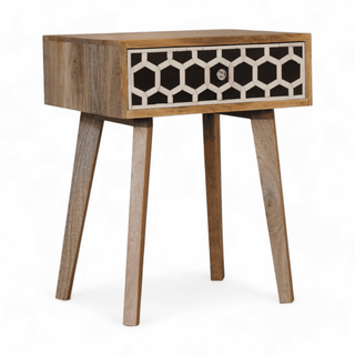 Angled front view of mango wood nightstand with a single honeycomb bone inlay drawer, showcasing elegant craftsmanship and modern style