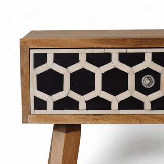 Angled side close-up of honeycomb bone inlay on mango wood nightstand, showcasing elegant joinery and natural wood finish