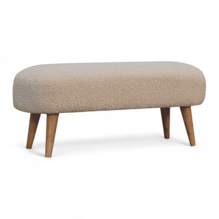 Angled right view of the boucle cream bench highlighting the modern silhouette and cream upholstery.