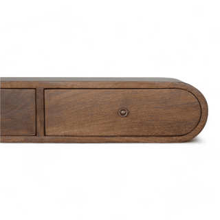 Close-up side view of a wooden console emphasizing the curved edges, smooth finish, and craftsmanship of the structure.