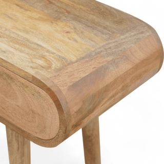 Detail view of the wooden console table’s top, highlighting its natural grain pattern and smooth rounded edges.