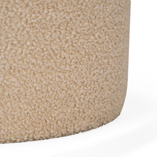 Close-up of the Cream Bouclé Ottoman fabric texture, revealing the soft and elegant bouclé material.