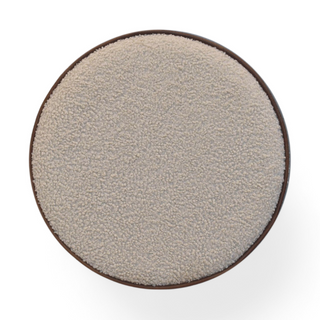 Top view of the Cream Bouclé Ottoman, featuring its perfectly circular design with fine fabric detailing. 