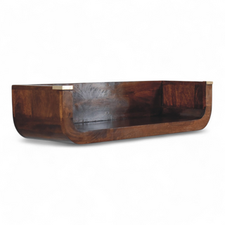 Front angled view of a dark wooden wall shelf with brass details on the corners, highlighting its elegant and functional design.