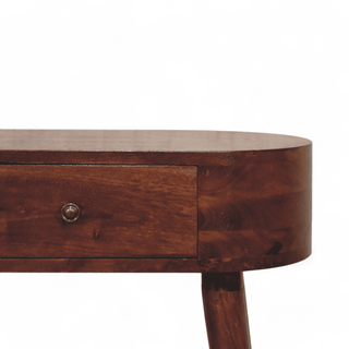 Close-up view of the drawer on a dark oval console table, showcasing its sleek wood grain, rounded knob, and smooth craftsmanship.