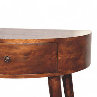 Close-up side view of the dark wooden console table showing its drawer, curved edge, and natural grain pattern.