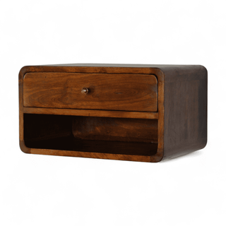 Angled view of floating nightstand with curved edges, single drawer, and open shelf, emphasizing the smooth walnut mango wood finish