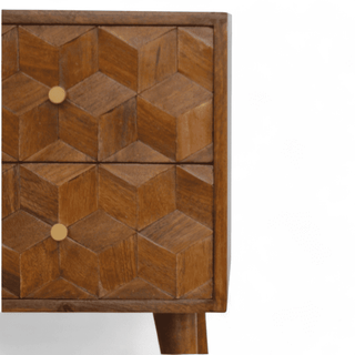 Close-up of geometric cube pattern on wood nightstand drawers, showcasing the craftsmanship and rich chestnut finish