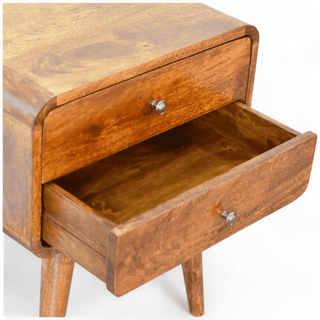 Open drawer of the mid-century modern nightstand showing spacious interior storage with the natural mango wood texture.