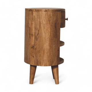 Side profile of the mid-century modern nightstand with its half-moon curved design and sturdy natural mango wood legs.