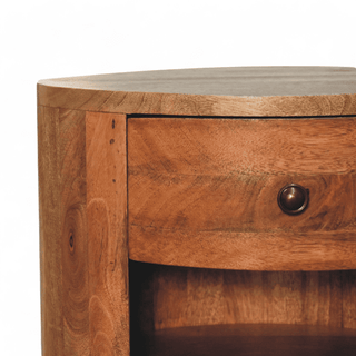 Close-up of the smooth natural mango wood top surface of the mid-century modern nightstand with a rounded half-moon design