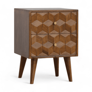 Side angled view of geometric wood nightstand with chestnut finish, highlighting the intricate hand-carved design and sturdy legs