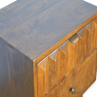 Close-up of the side panel on the mango wood nightstand, showcasing its natural wood grain and seamless joinery with a chestnut finish