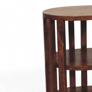 Close-up of mid-century dark walnut oval nightstand, showcasing slatted side design and smooth shelf finish