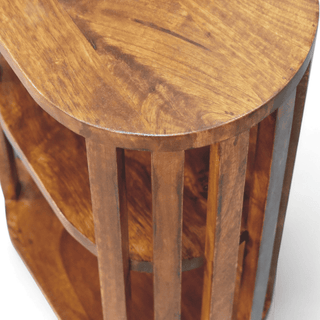 Top-down view of mid-century solid wood oval nightstand, highlighting the rich grain pattern on its dark walnut surface