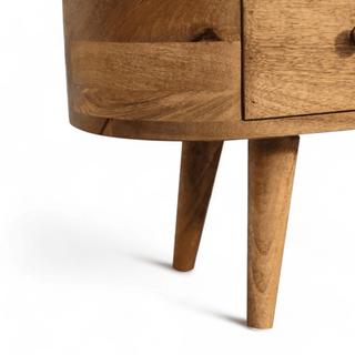 Close-up of the Mini Rounded Entertainment Unit’s leg design, highlighting its tapered Nordic-style legs and wood finish.