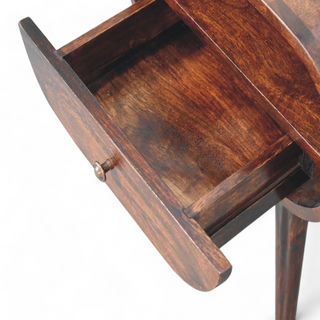 Open drawer of the oval nightstand revealing its spacious interior with a smooth wood finish.