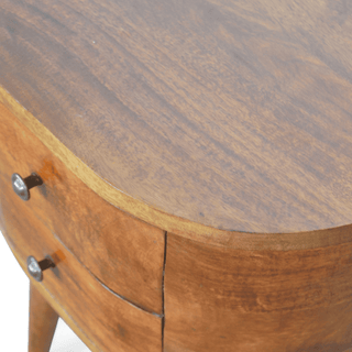 Close-up detail view of mid-century modern round-edge nightstand, showcasing the smooth mango wood surface, curved edges, and chestnut finish