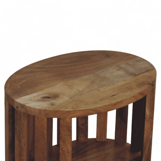 Top view of round mango wood nightstand, highlighting smooth surface and rich grain patterns on natural wood finish