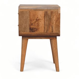 Side perspective of a mid-century nightstand with woven rattan drawer fronts and solid mango wood frame.