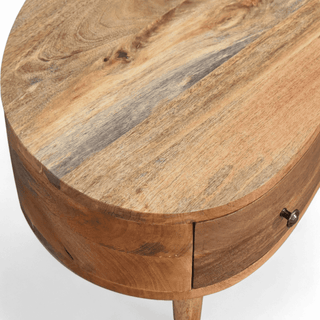 Overhead view of the coffee table's smooth wooden surface and open compartment.