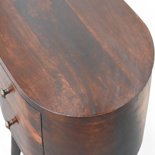 Top view of the round walnut nightstand showcasing its smooth, dark walnut surface and natural wood grain texture.