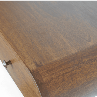 Detail view of the wooden console’s top surface, showcasing its natural grain pattern and polished finish.
